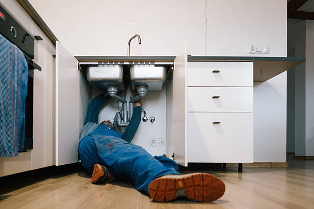 Professional Emergency Plumber technician working in Fenton, IA